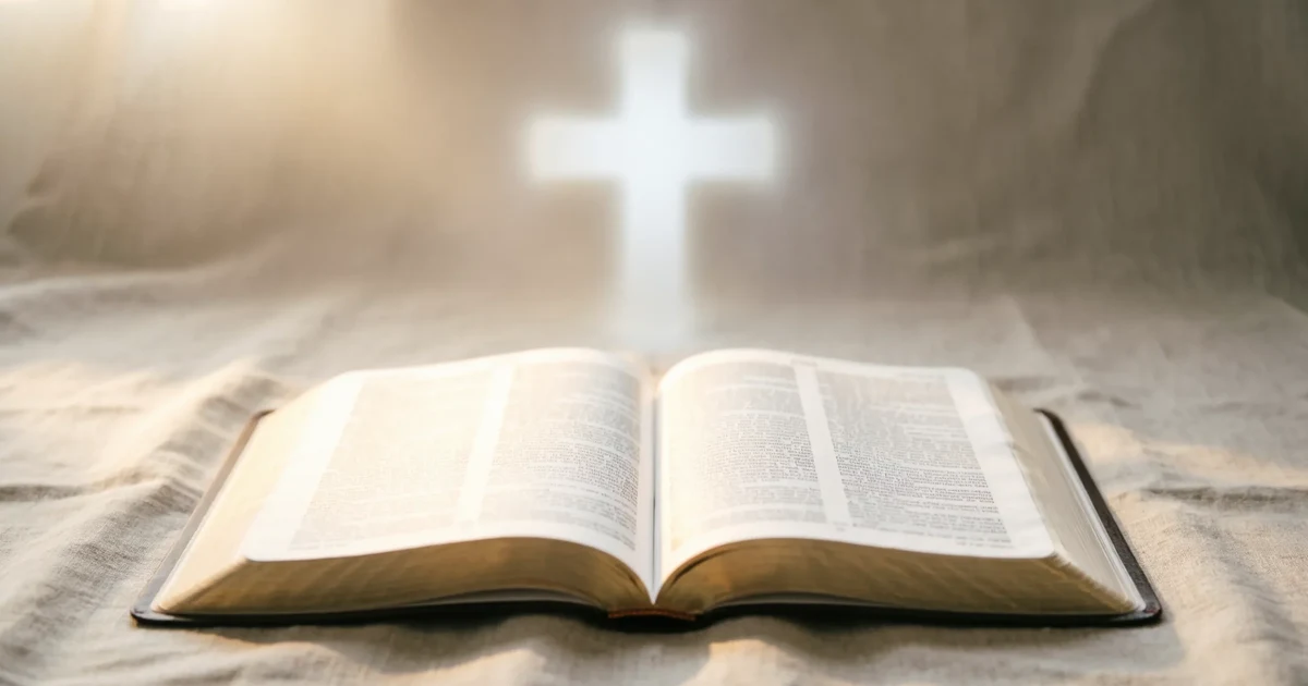 Open Bible with glowing light and cross symbol representing idioms for Jesus and religious expressions